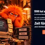 Orangefarbenes Fellmonster stützt gelangweilt den Kopf neben einem verstaubten Röhrencomputer mit der Anzeige „Marketing Version 1998“. Am Monitor kleben Zettel mit Flyer, Zeitung, Kaltakquise, Gelbe Seiten, Plakate und Fax, daneben Ordner mit Print, Messen und Klassische Werbung. Rechts steht: „1998 hat angerufen. Zeit für fresch.“